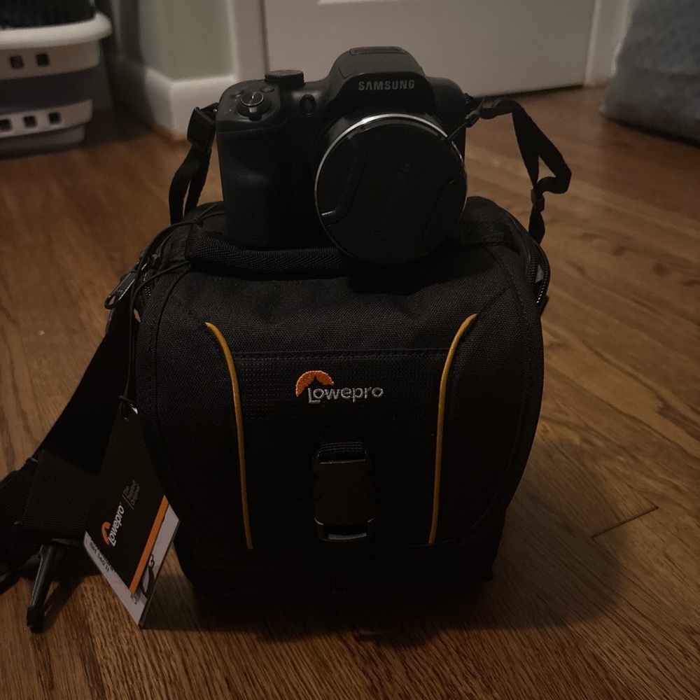 Samsung Black Camera with Lowepro Black and Orange Bag